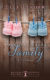 Knit baby booties with wood plank background